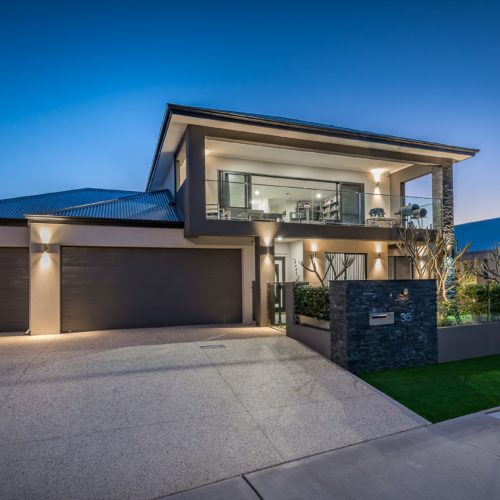 Front of a modern property in Perth at night time.