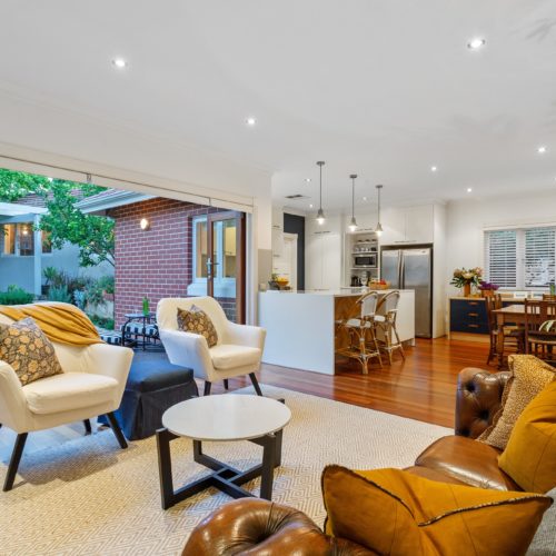 Modern styled living room with mustard styling tones.