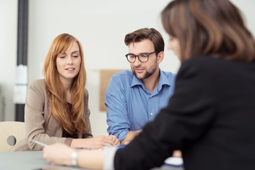 Couple having a meeting with a property manager,