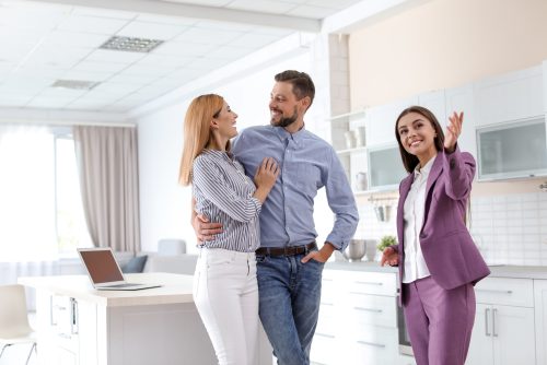 Property manager showing potential tenants a rental property.